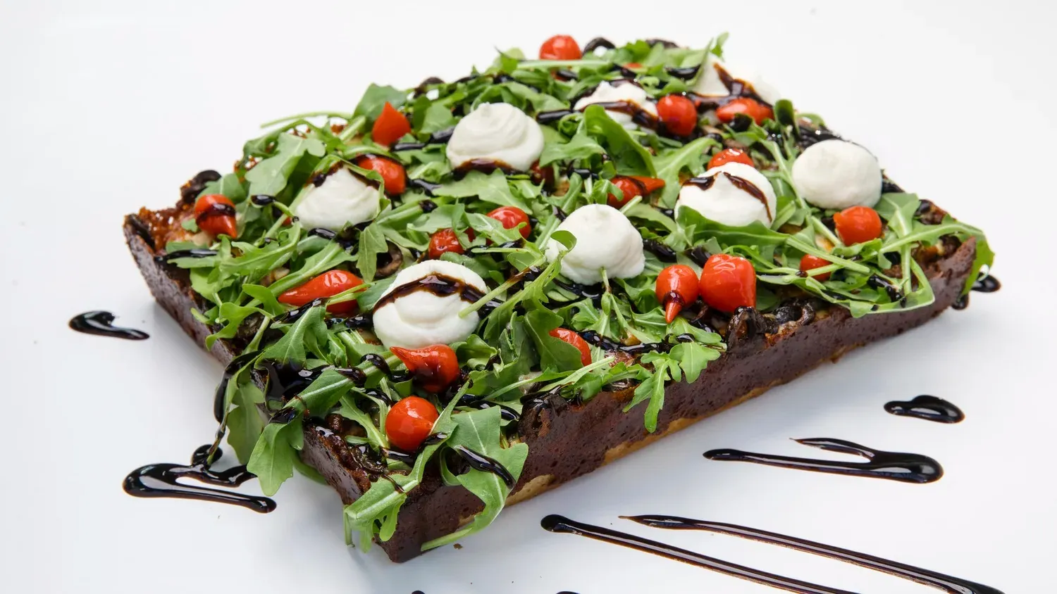 A slice of Detroit-style pizza.